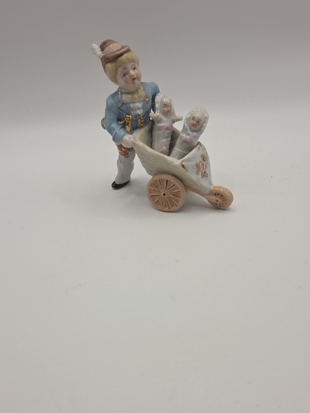 Porcelain Man With Wheelbarrow And 2 Babies. Vintage German Porcelain
